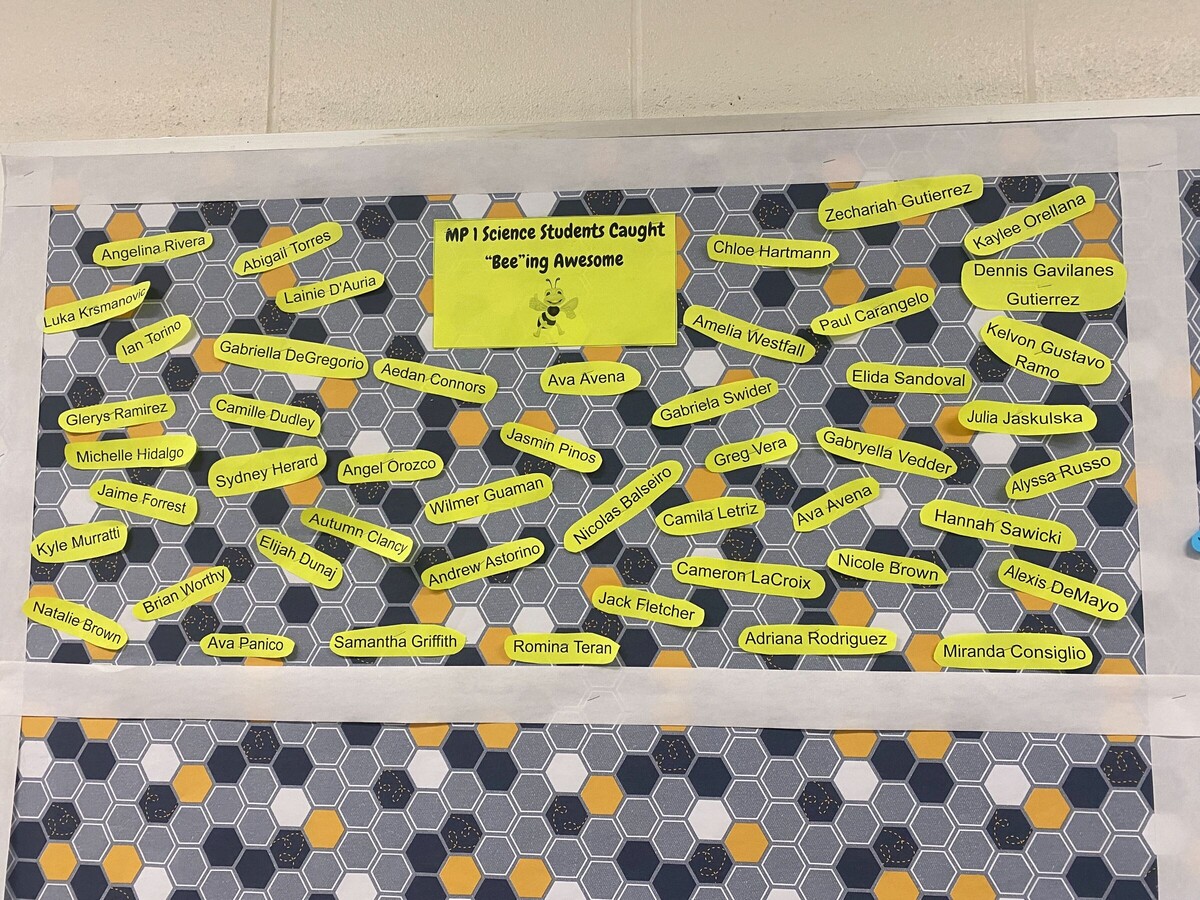 Bulletin board featuring recipients of awards in marking period 2