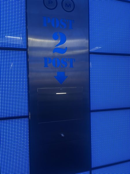 A door with the phrase "Post 2 Post" and a down arrow pointing to a slot.