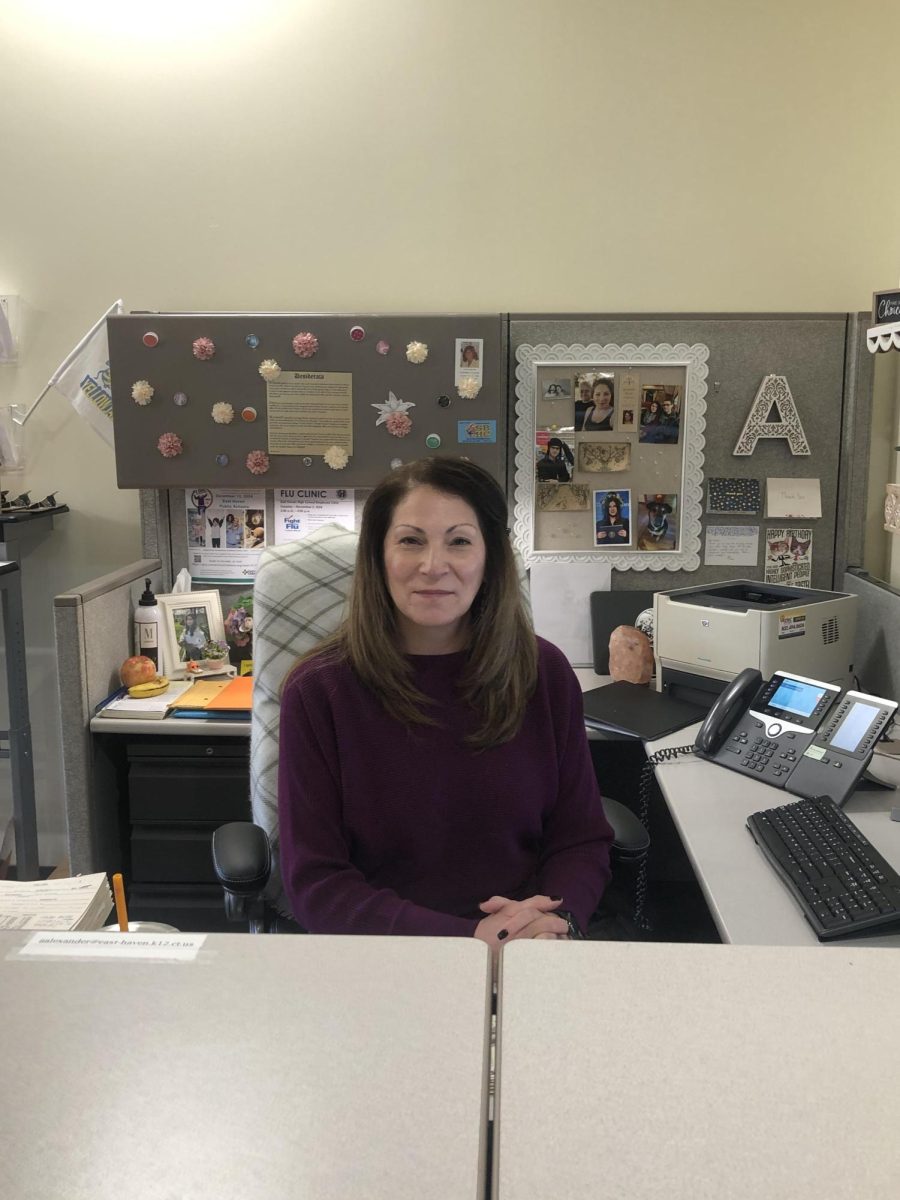 Photo of Mrs. Alexander at her desk in the guidance office 