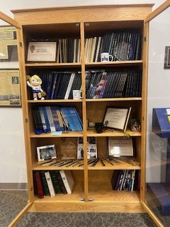 Storage cubby in the main office full with yearbooks 