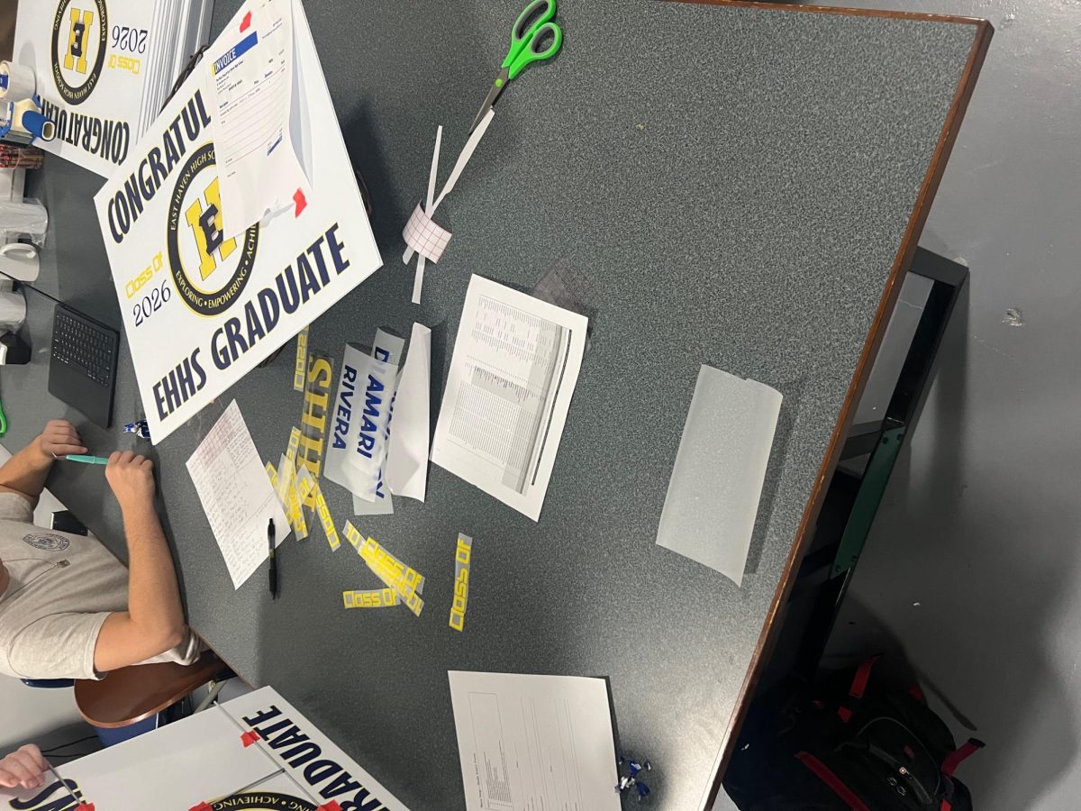Graduation signs being customized in Makerspace